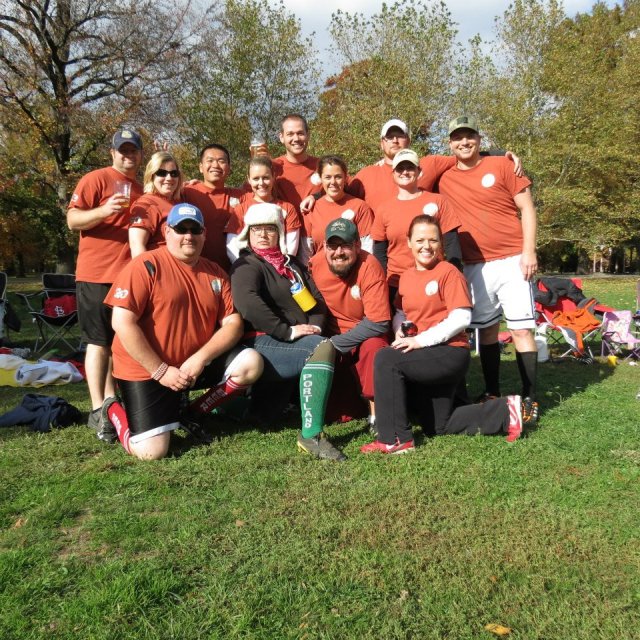 This is a short version of our huge Kickball Team. I am int he green socks in front.  Chris is the tall guy in the back with the beer- Dead Center- as he always is and always will be! Awesome-sauce!